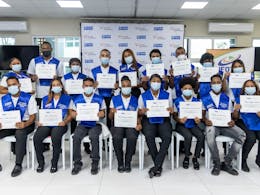 group TUI Academy graduate students with their certificates