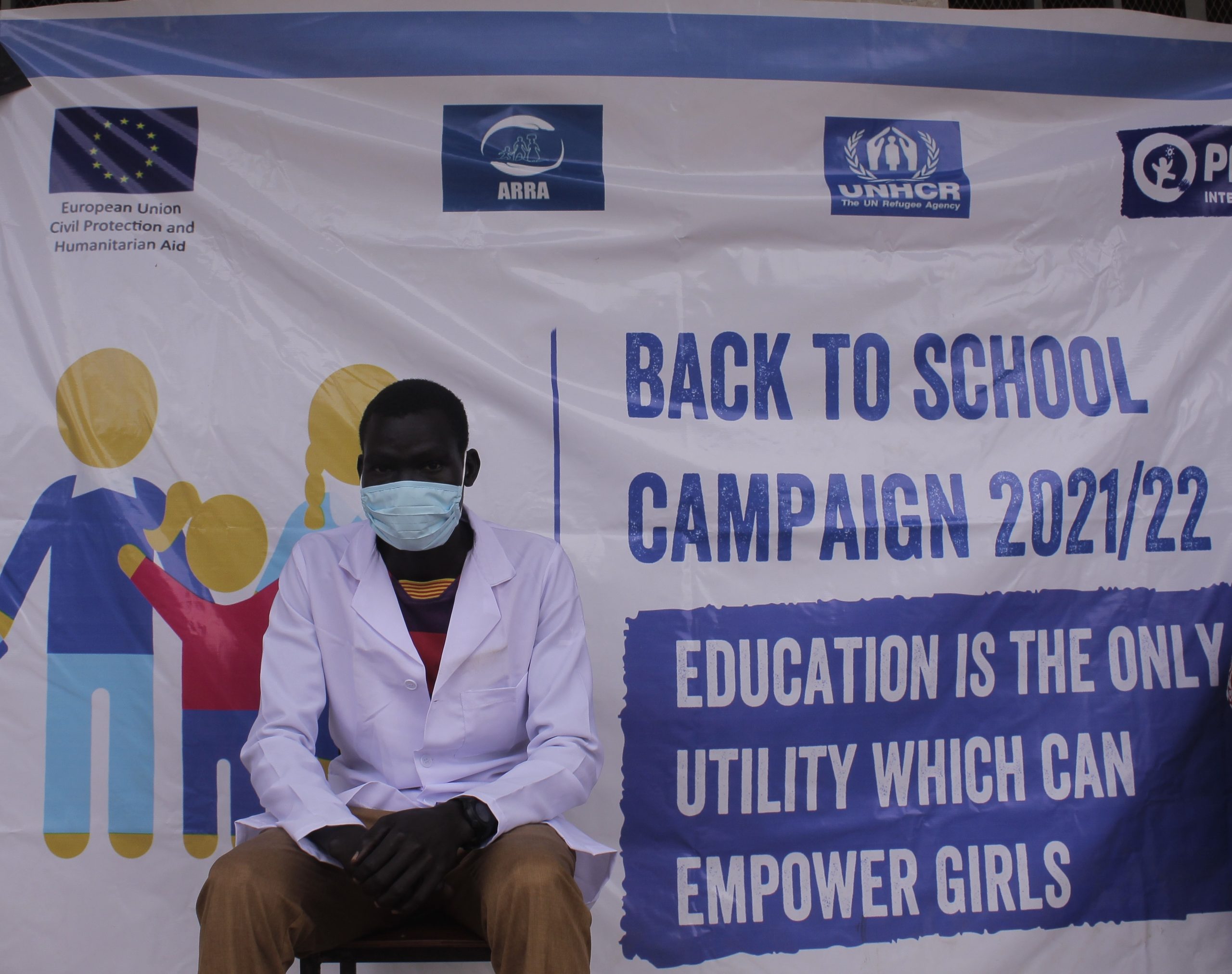 Tut met Plan International banner