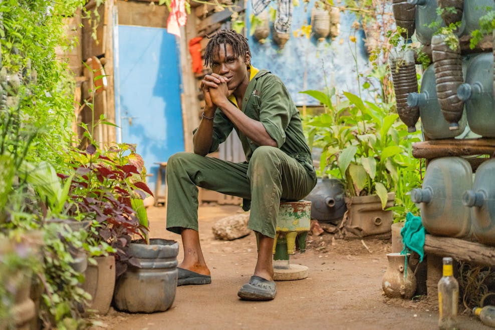 Bogere in een van de moestuinen die hij heeft opgezet | © Plan International